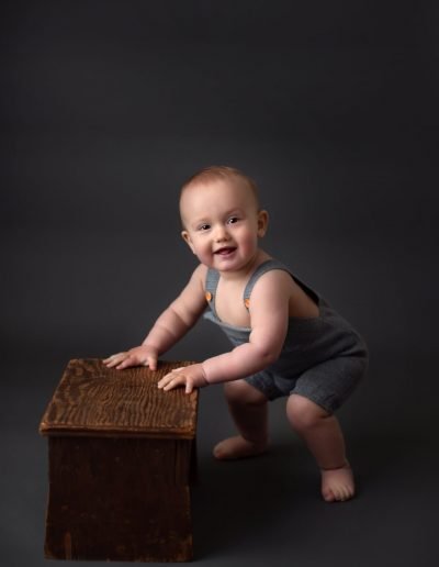 baby climbing on step stool
