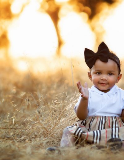 Ripon Baby photos outside smiling with hairbow