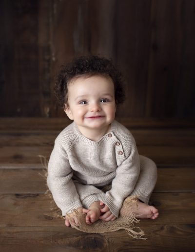 Ripon infant in front of dark background