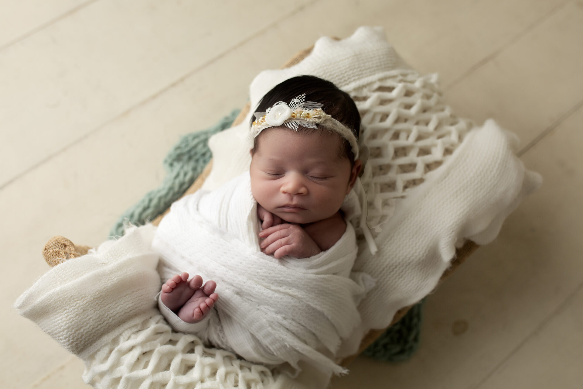 Newborn baby swaddled in Manteca CA photography studio