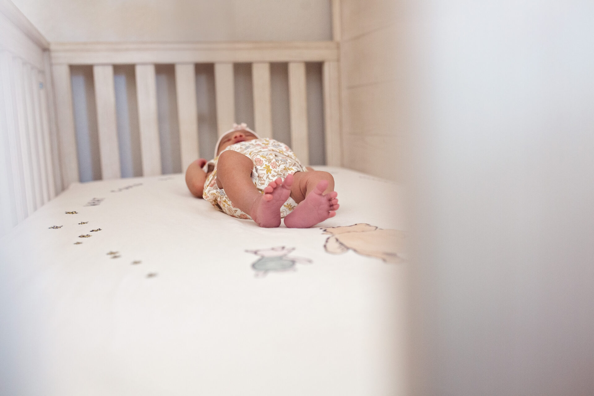 Lifestyle newborn session in Roseville home with soft window light