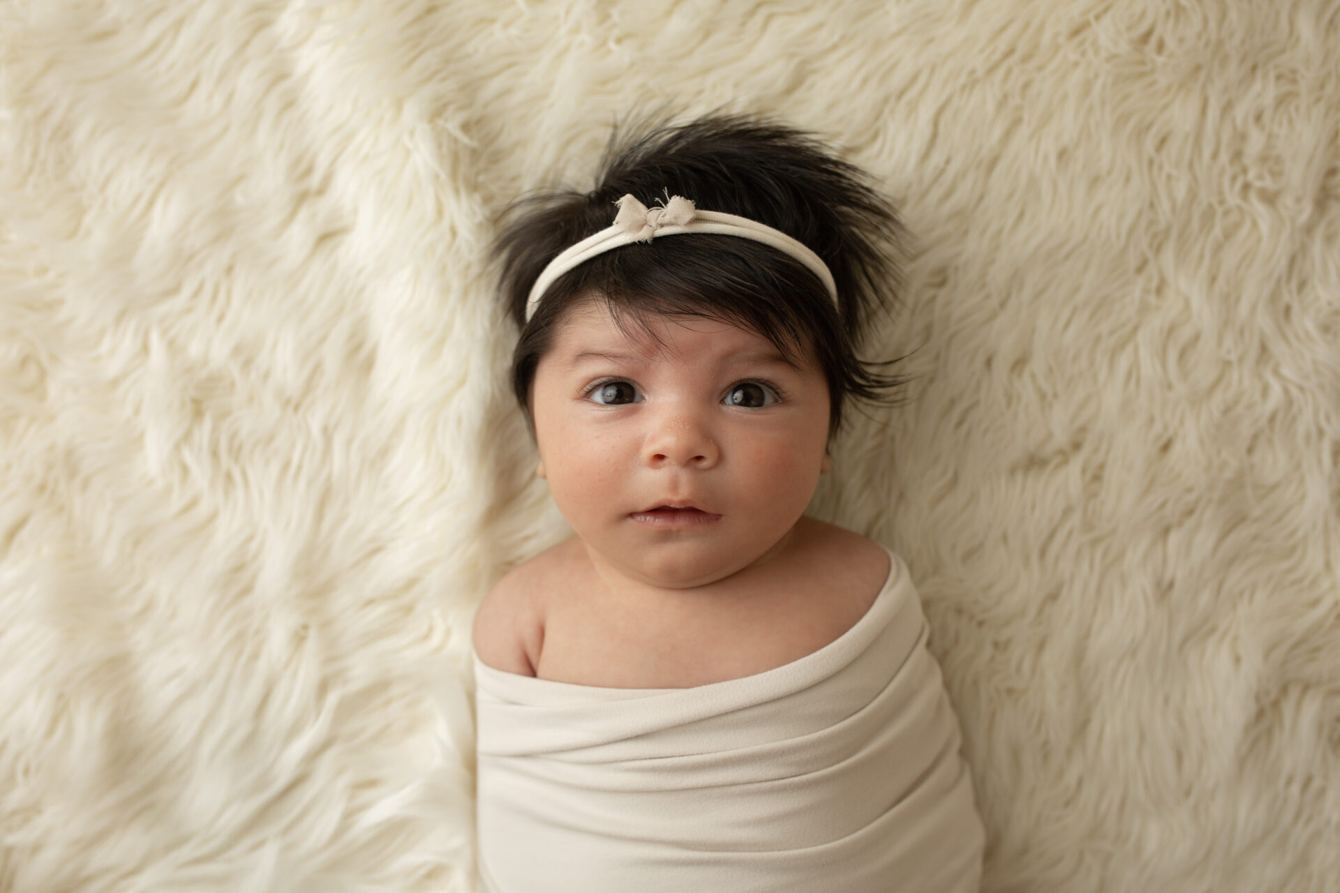 manteca newborn baby wrapped neutral tones