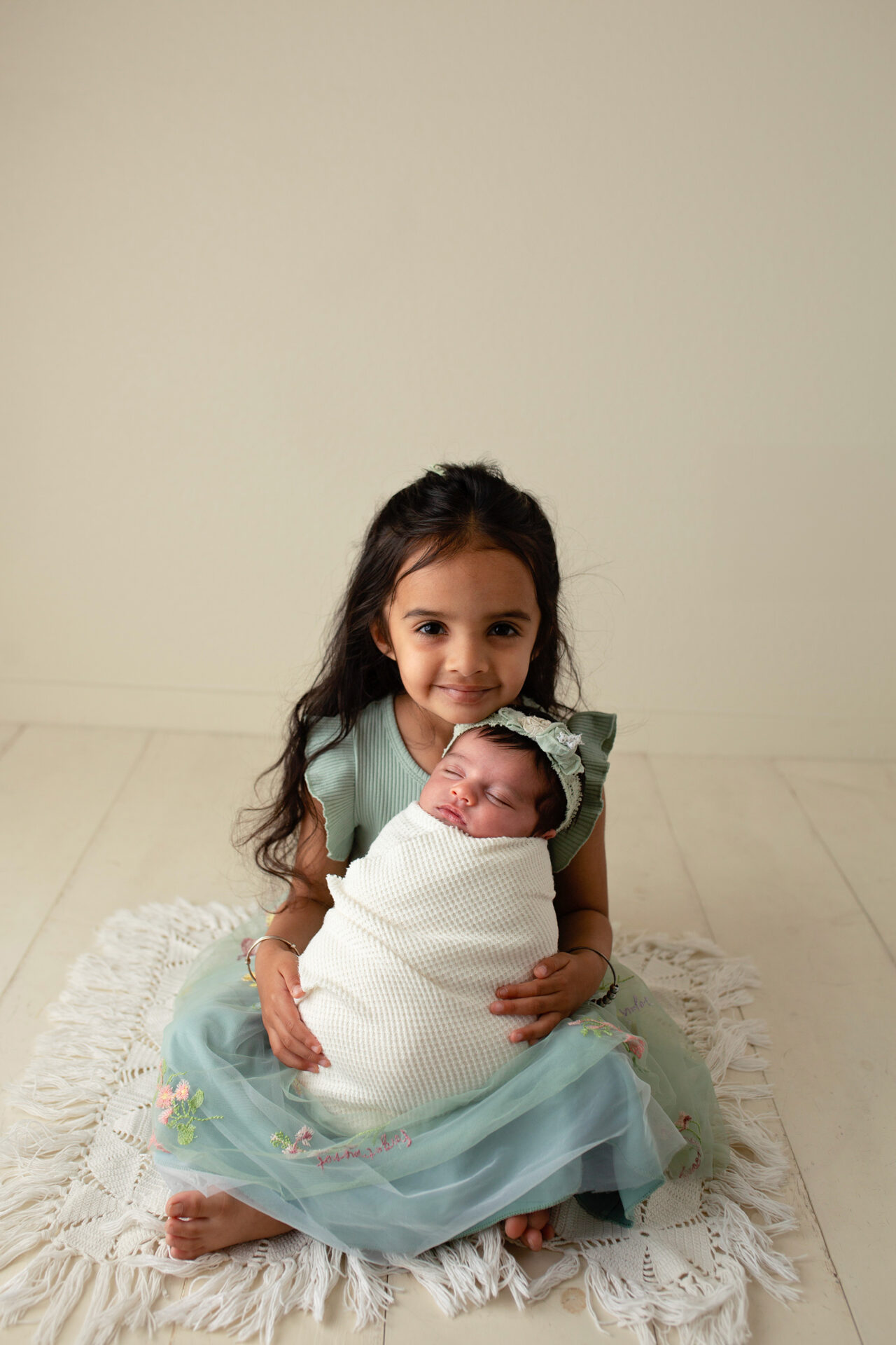 manteca newborn photographer capturing baby and sister