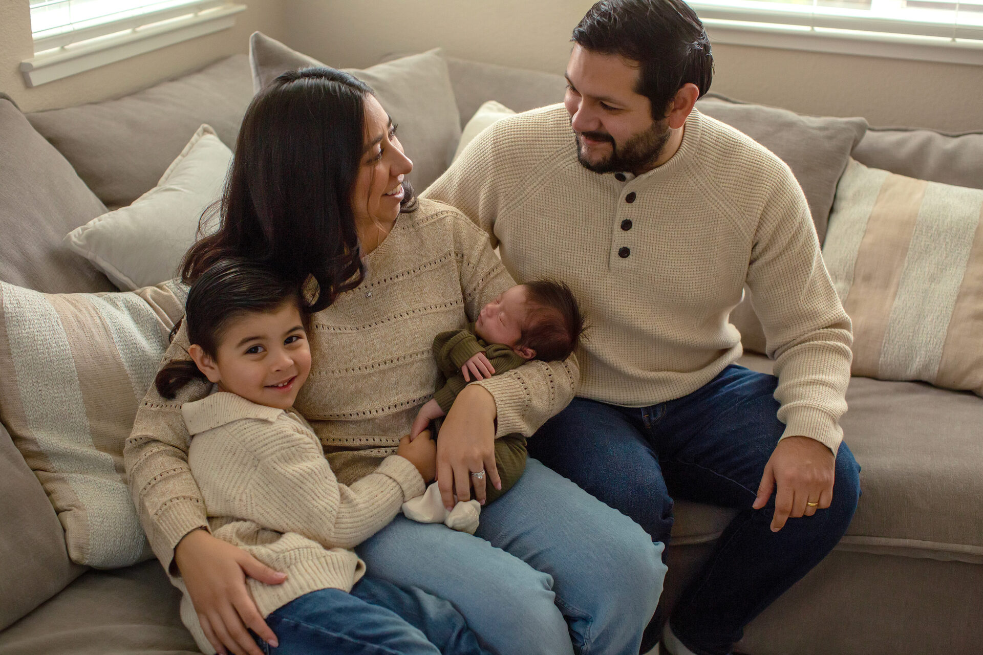 Newborn photography session in Roseville with baby and family in natural light