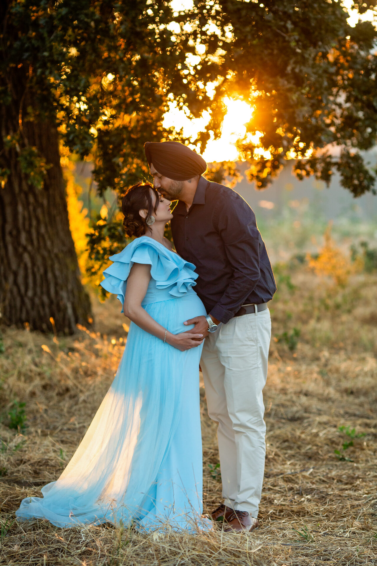 Parents-to-be sharing a quiet moment during their maternity photos.