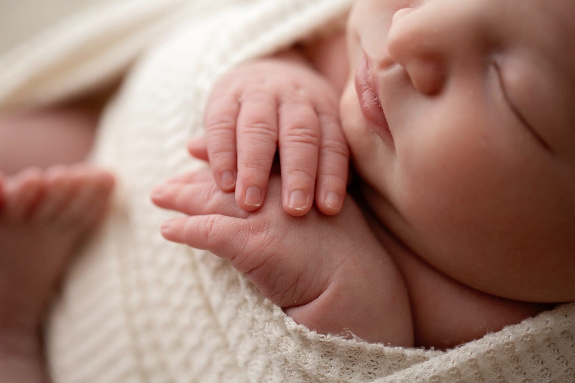 Close-up of tiny newborn fingers
